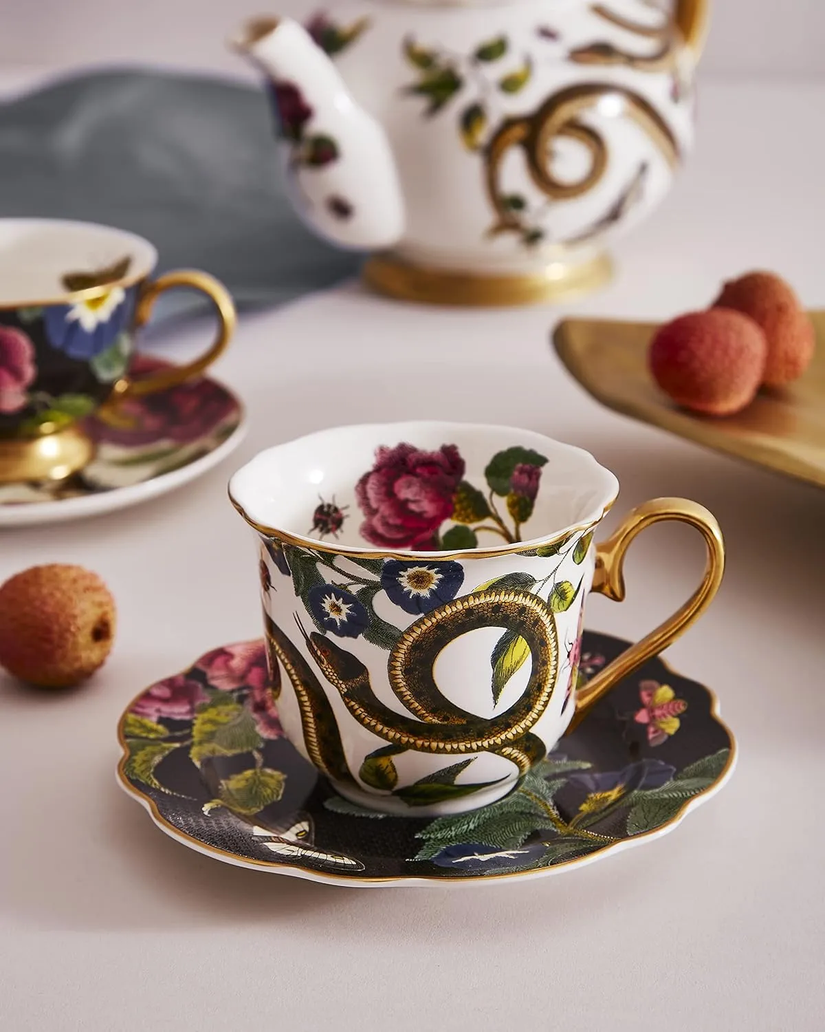 Spode Creatures of Curiosity Collection Teacup and Saucer Set, Fluted Black Floral Saucer and Snake Mug, Gold Trim, British Tea Cup Set, 8.45 Ounce, Made of Fine China, Hand Wash